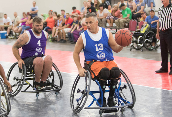 Image of Jimmy Green playing wheelchair basketball
